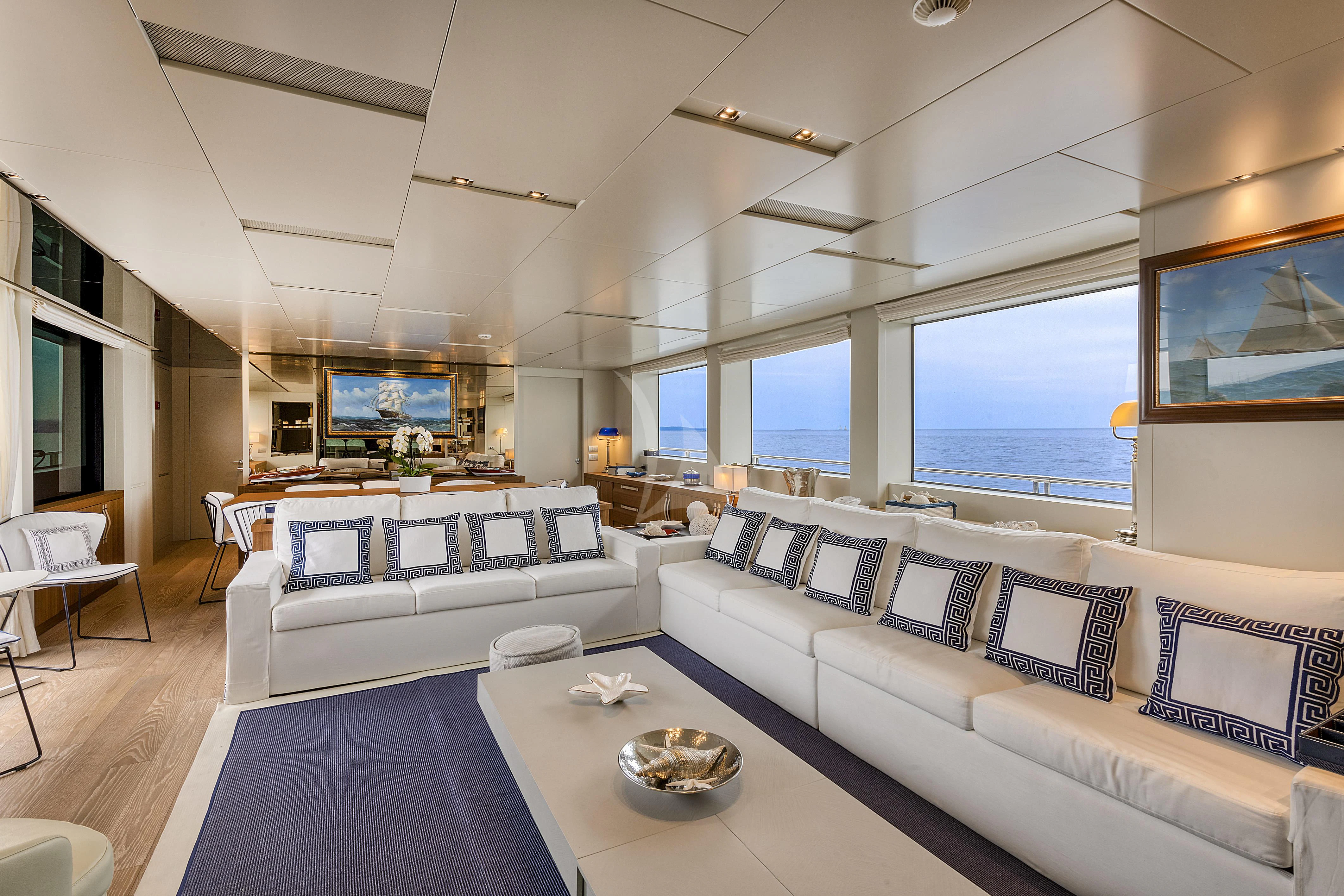 a living room with a large window aboard VITTORIA Yacht for Charter