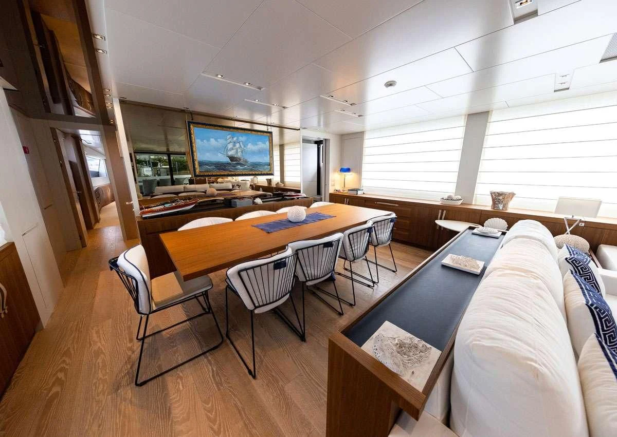 a living room with a couch and a television aboard VITTORIA Yacht for Charter