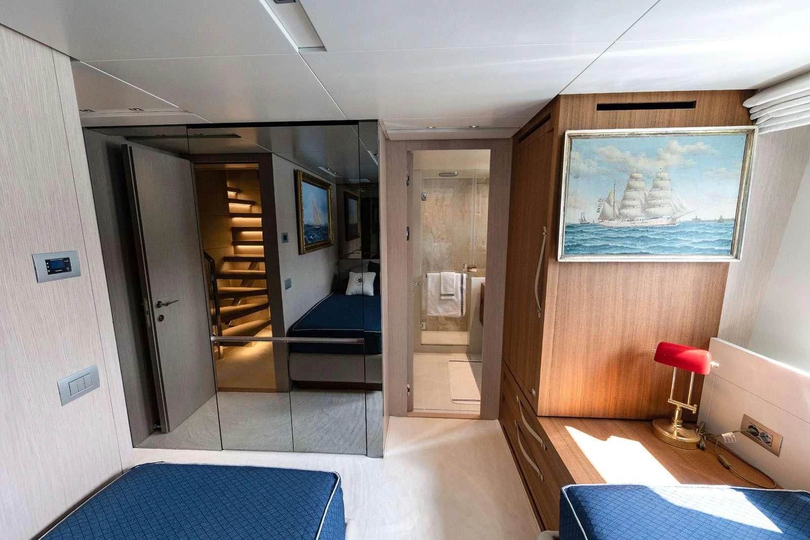 a room with a bed and a door aboard VITTORIA Yacht for Charter
