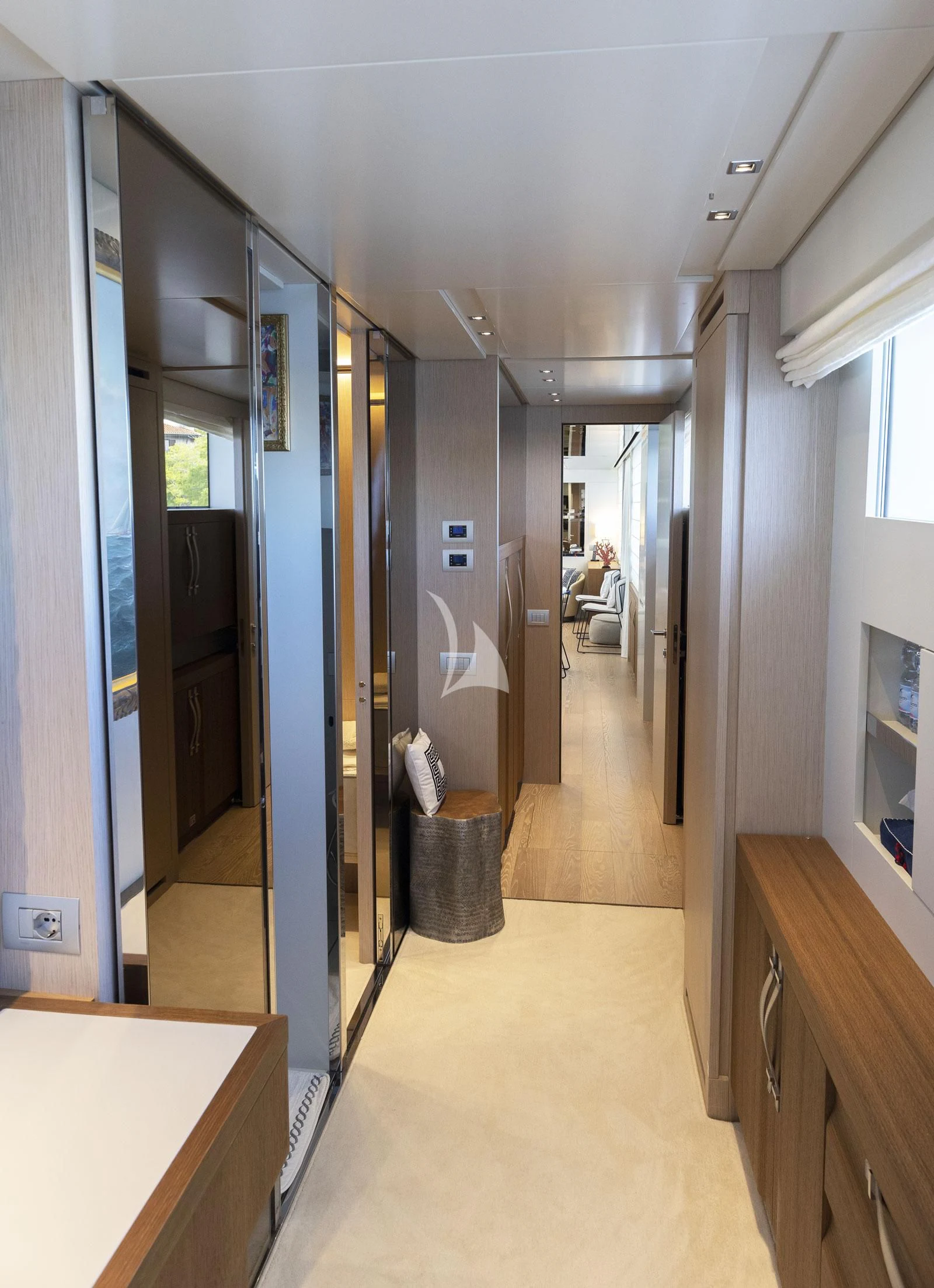 a hallway with a table and a chair aboard VITTORIA Yacht for Charter