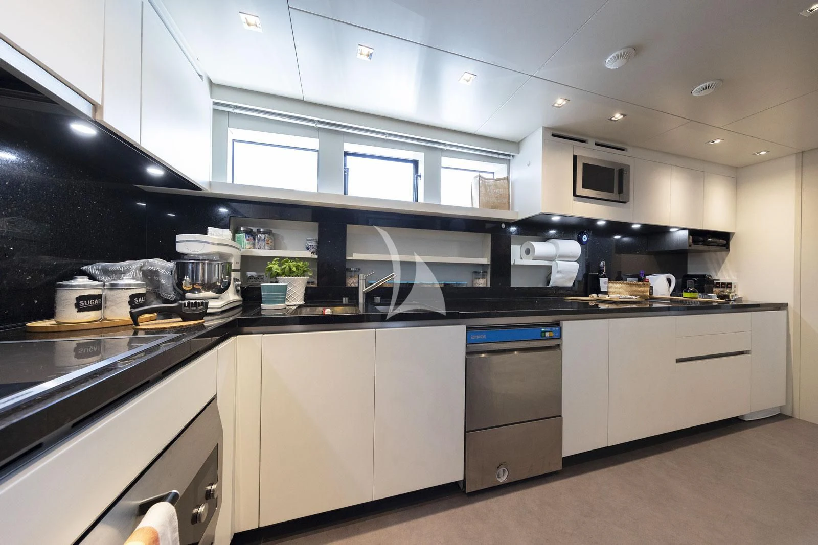 a kitchen with a lot of cabinets aboard VITTORIA Yacht for Charter