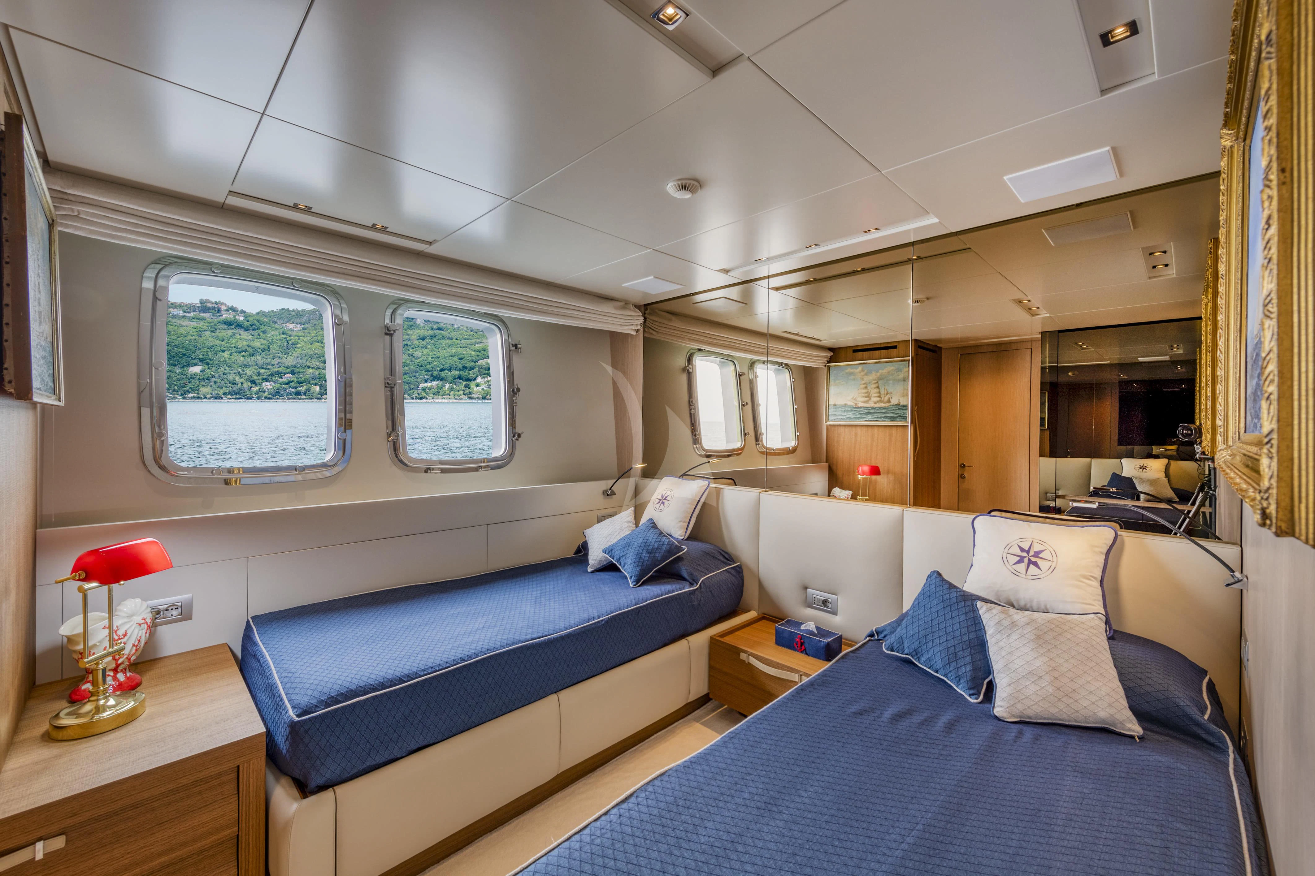 a room with a bed and a window aboard VITTORIA Yacht for Charter