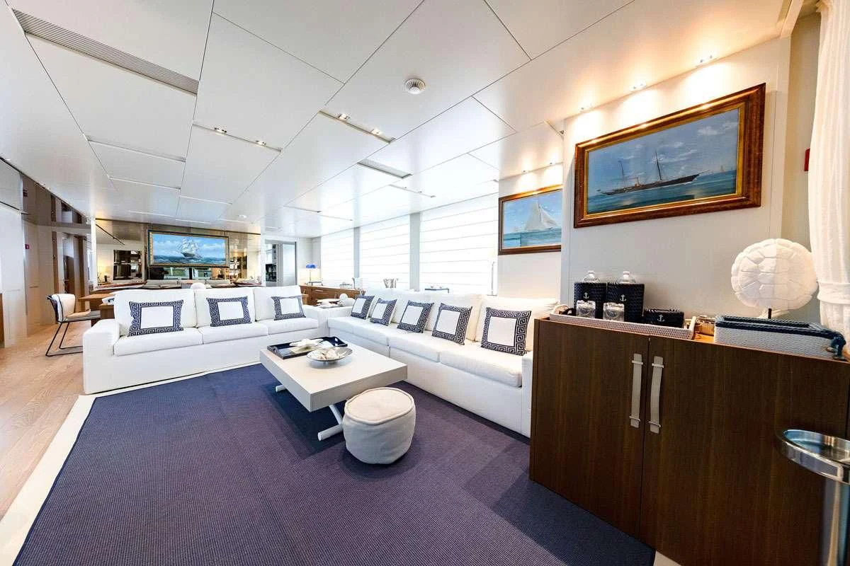 a room with a couch and a table aboard VITTORIA Yacht for Charter