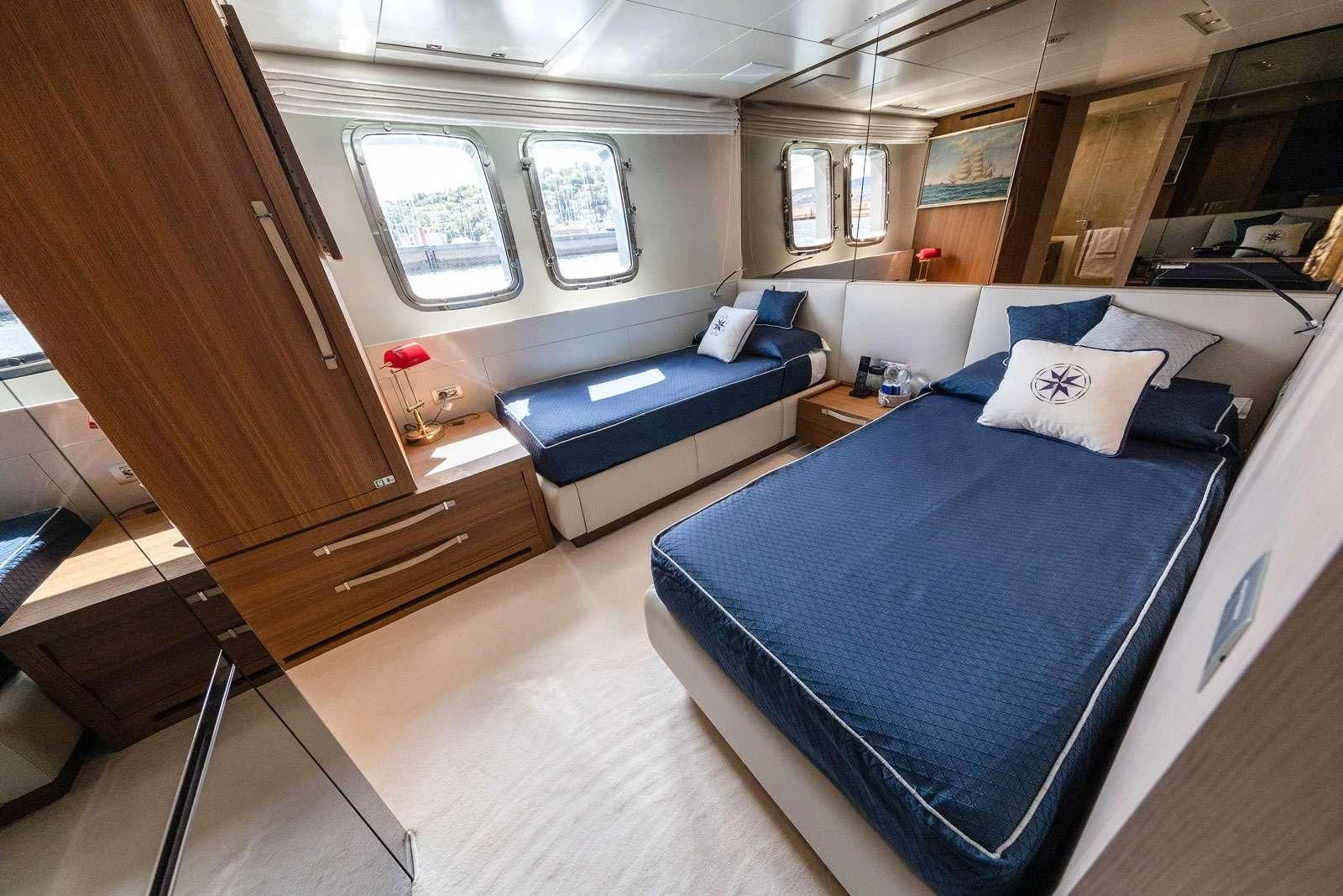 a room with a bed and a couch aboard VITTORIA Yacht for Charter