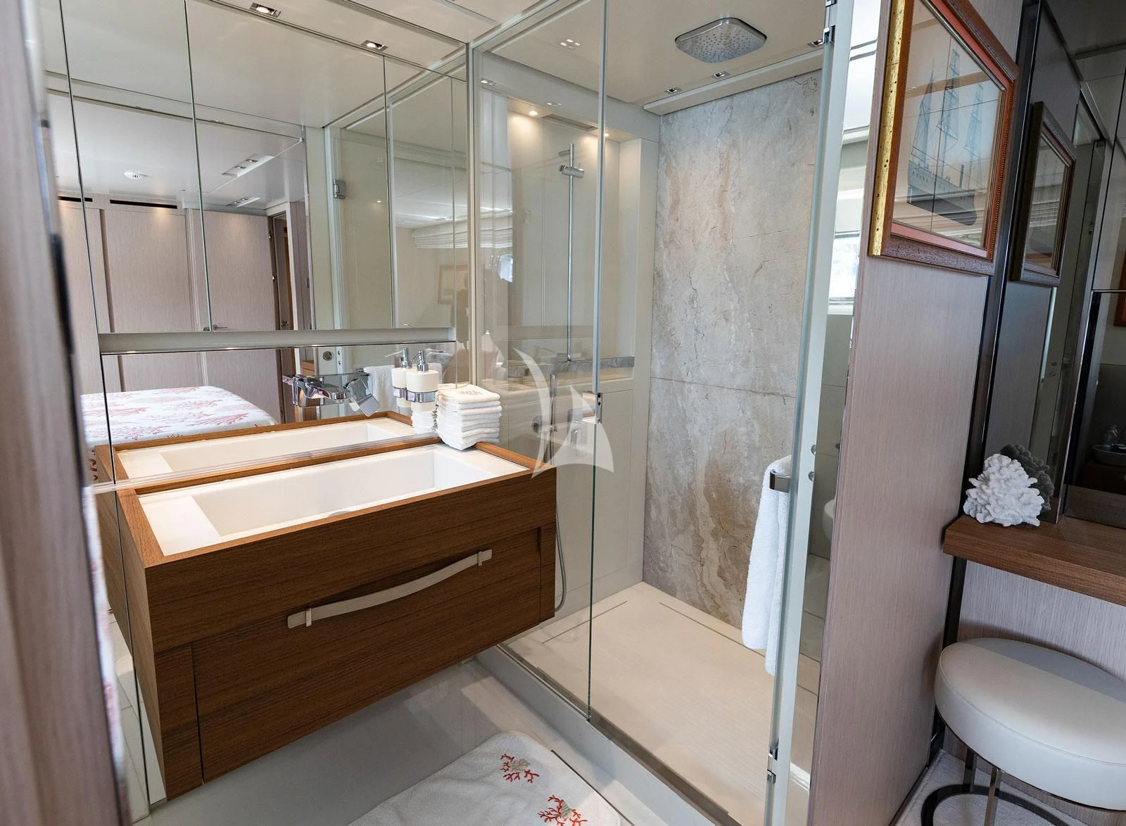 a bathroom with a glass shower aboard VITTORIA Yacht for Charter