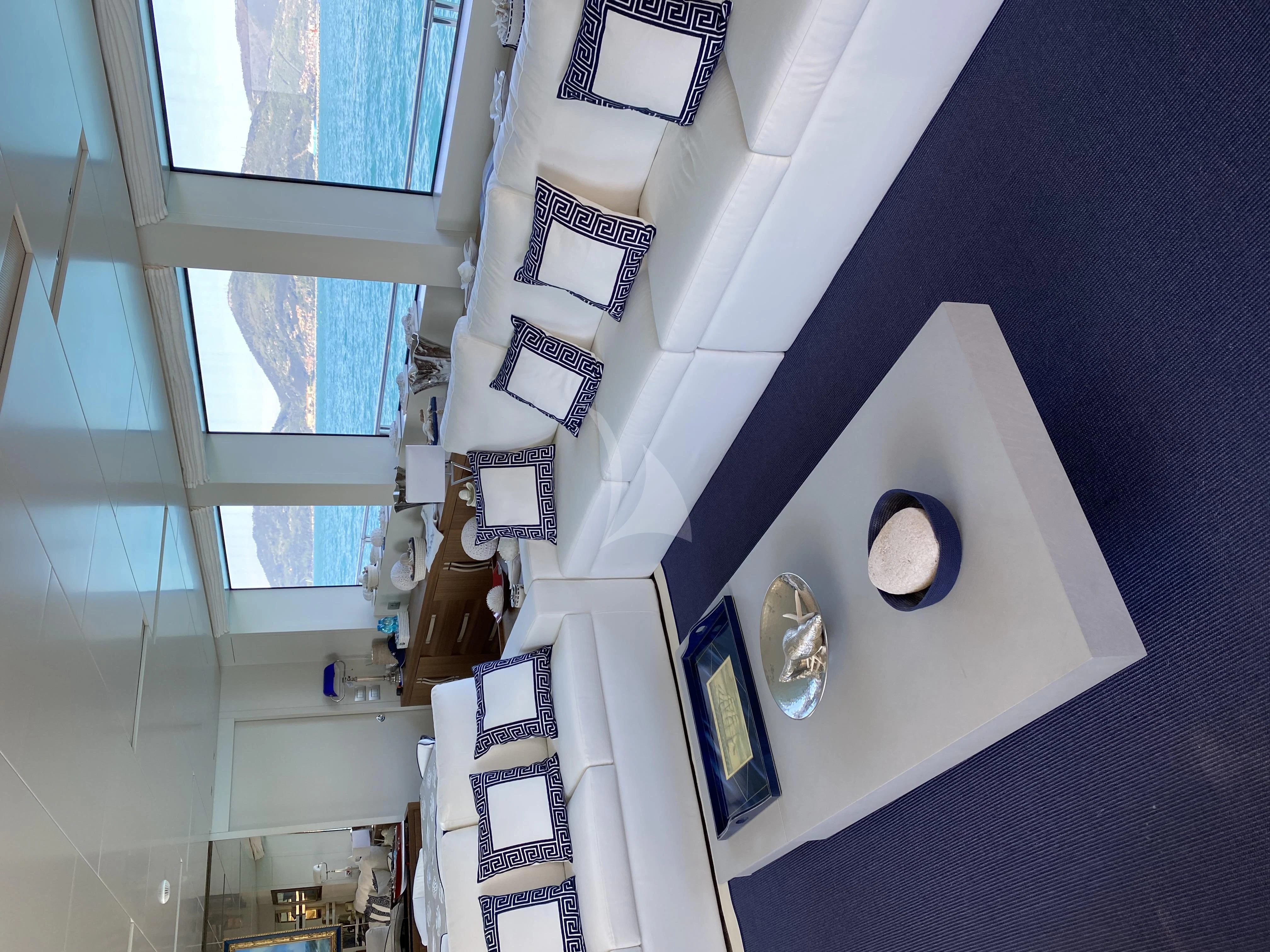 a white building with a blue wall aboard VITTORIA Yacht for Charter