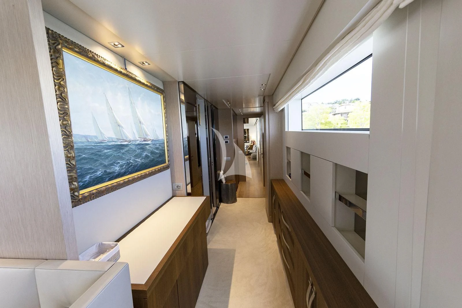 a hallway with a large blue window aboard VITTORIA Yacht for Charter