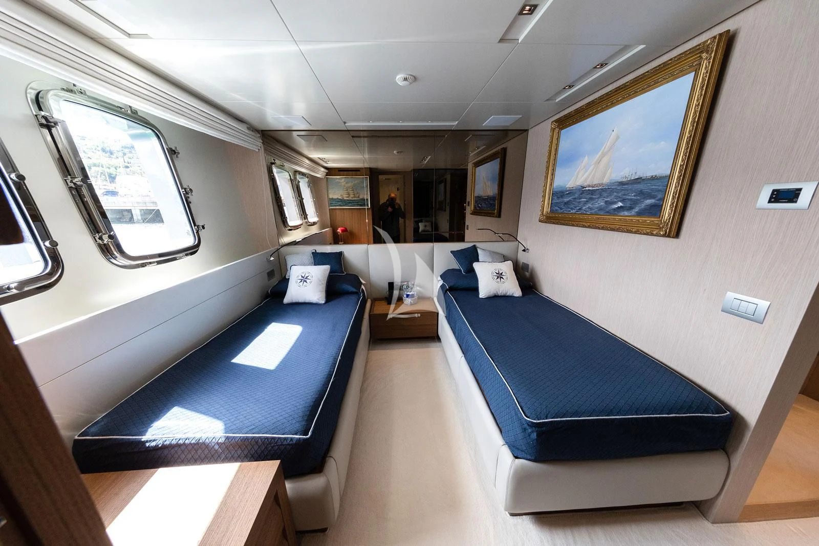a room with a bed and a desk aboard VITTORIA Yacht for Charter