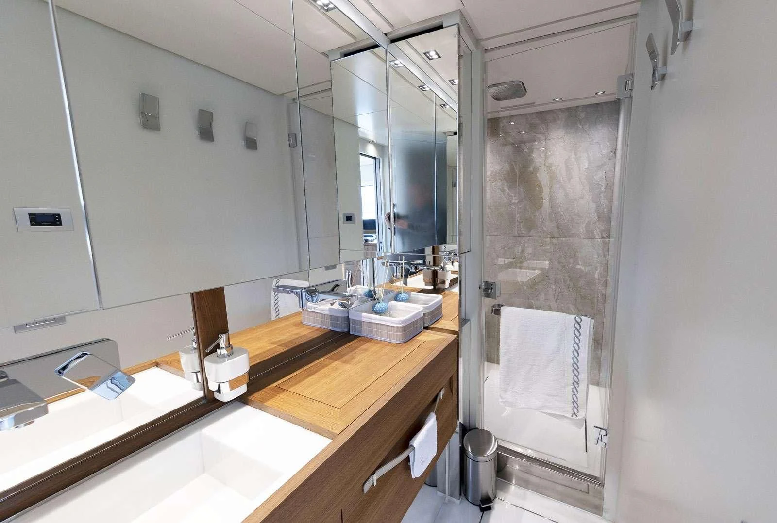 a bathroom with a sink and a mirror aboard VITTORIA Yacht for Charter