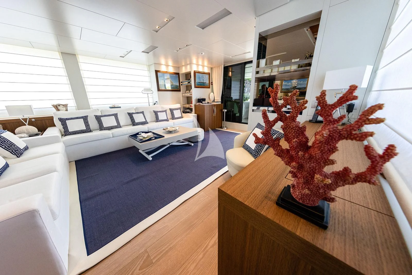 a living room with a couch and a table aboard VITTORIA Yacht for Charter