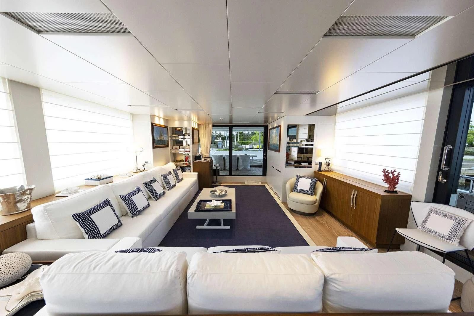 a living room with a large window aboard VITTORIA Yacht for Charter