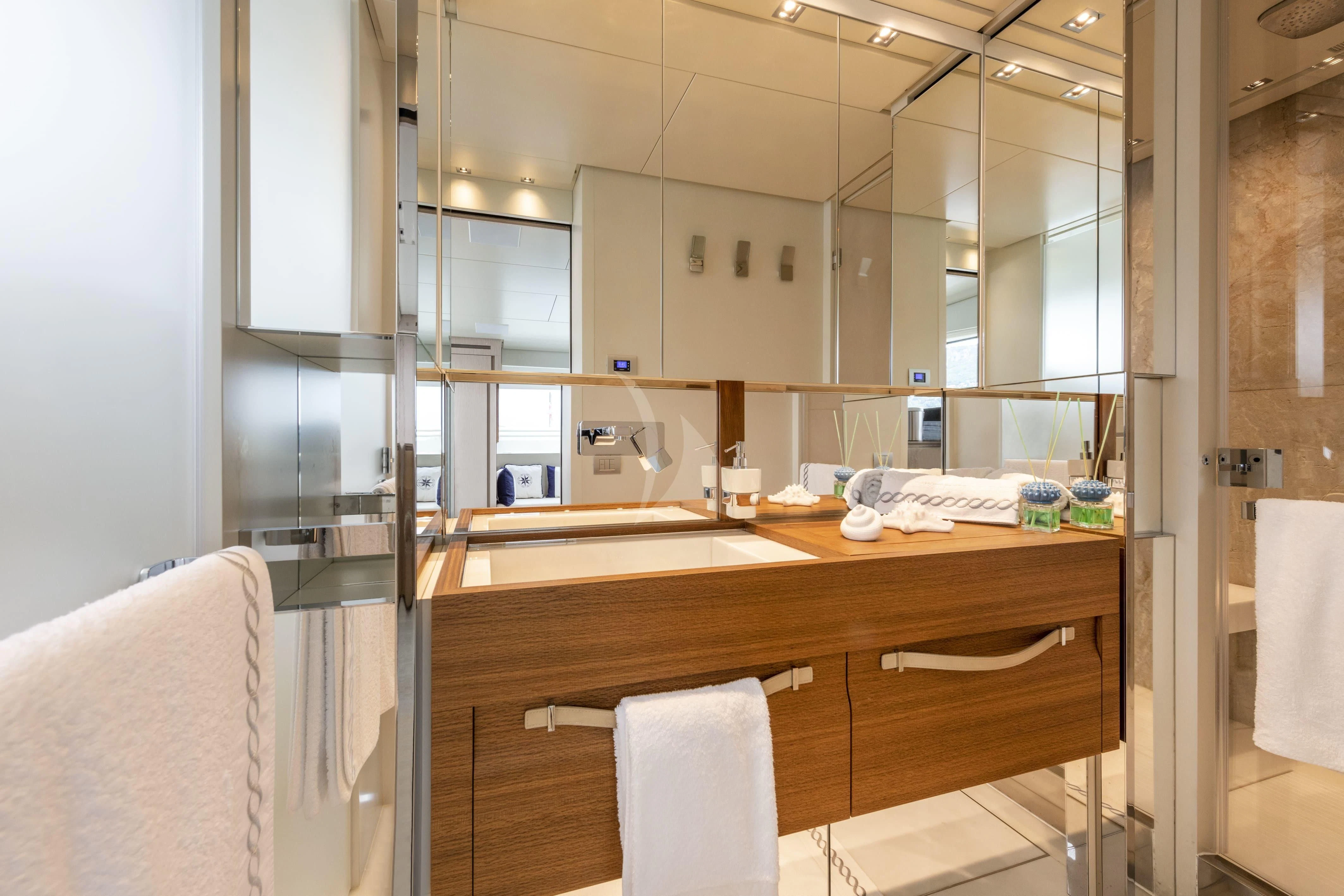 a bathroom with a sink and mirror aboard VITTORIA Yacht for Charter