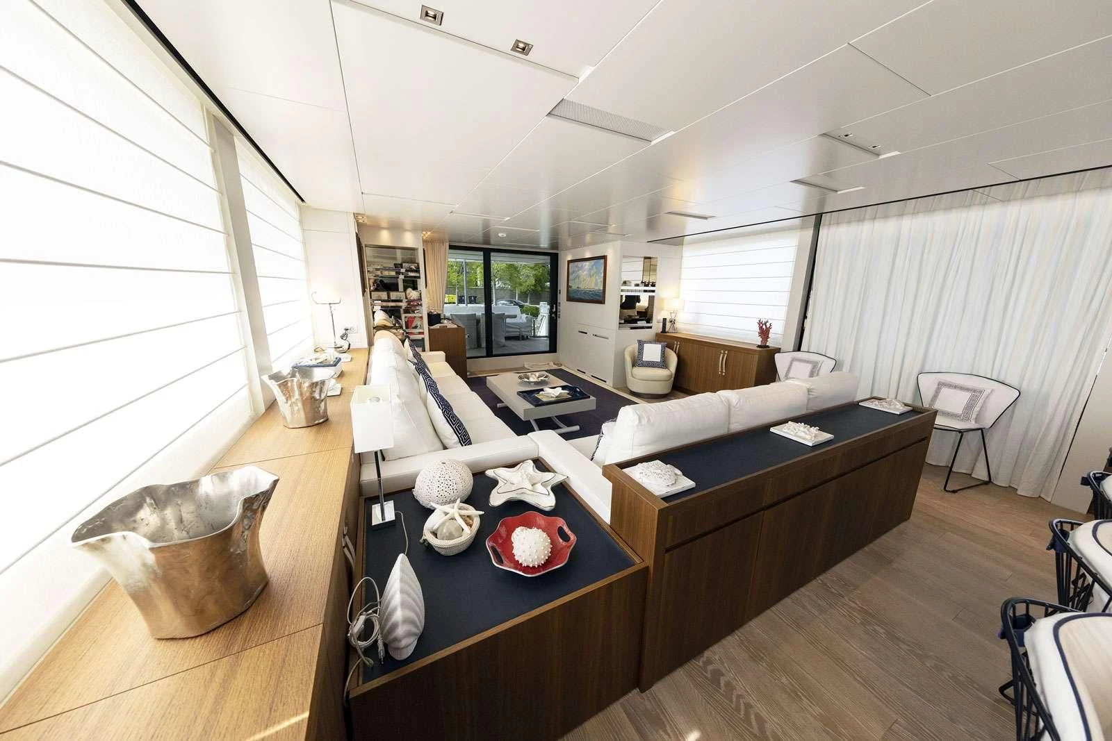 a room with a table and chairs aboard VITTORIA Yacht for Charter