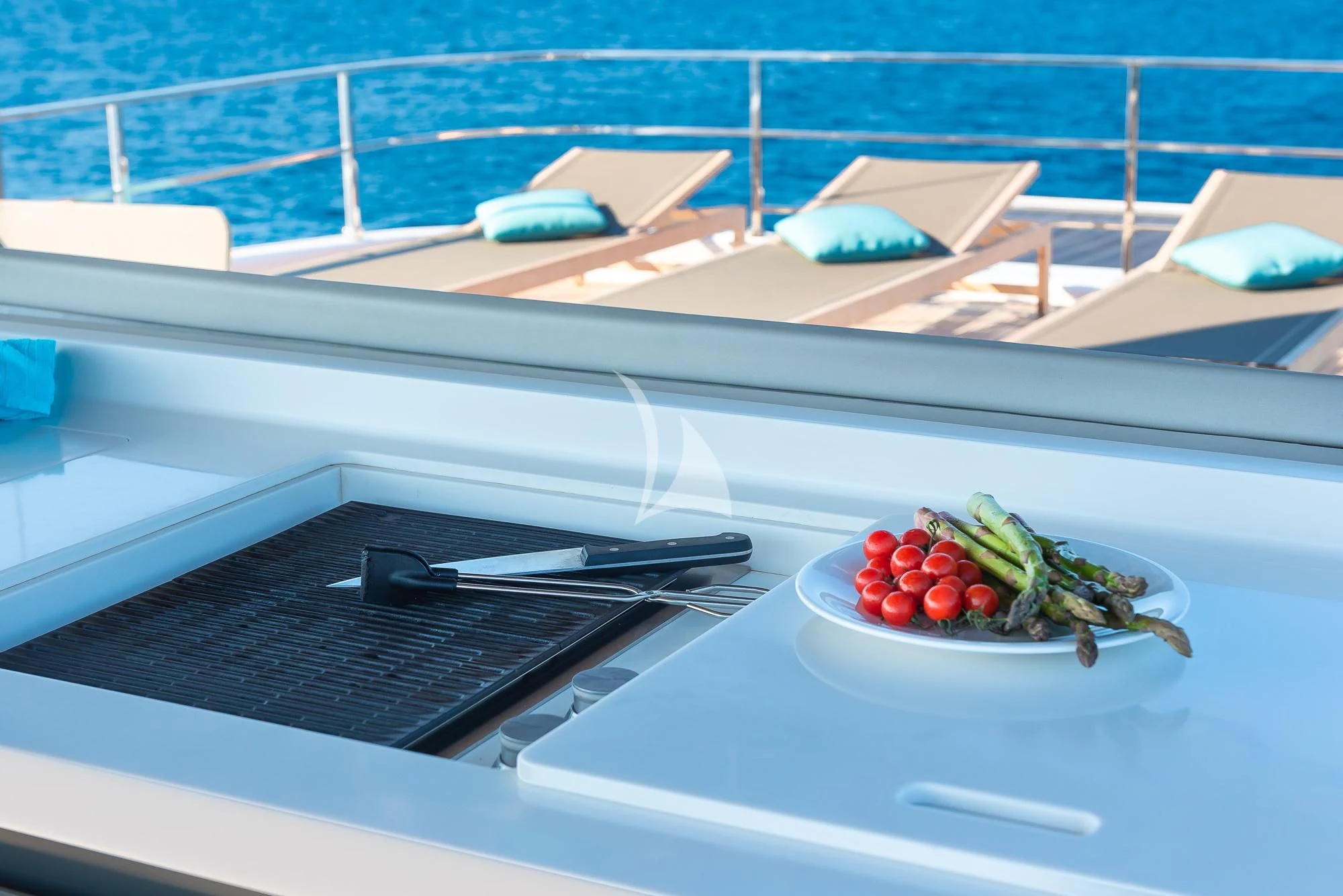a plate of tomatoes on a table aboard ACQUA Yacht for Sale