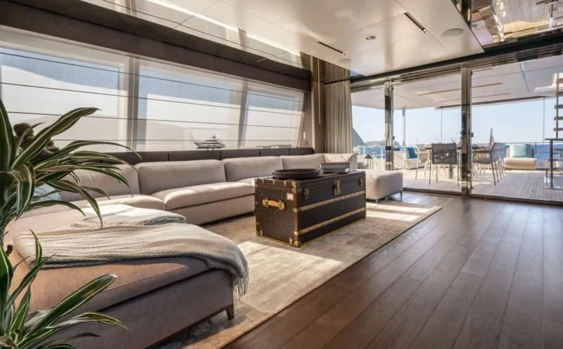 a room with a couch and a table aboard ACQUA Yacht for Sale