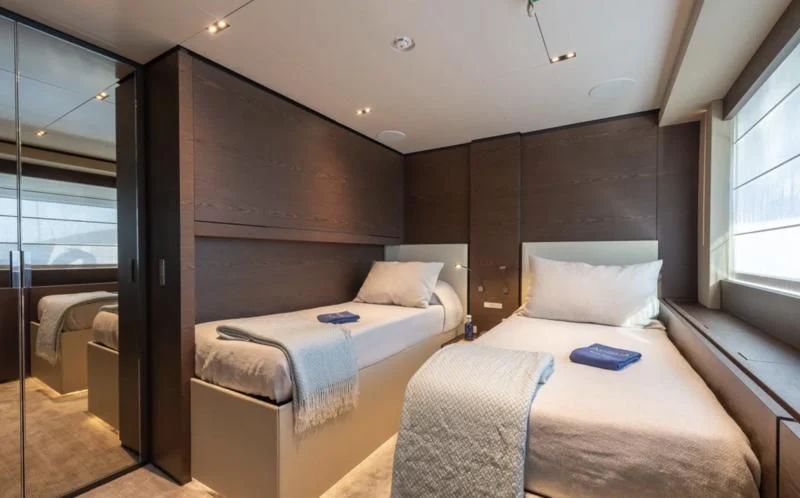 a room with two beds aboard ACQUA Yacht for Sale