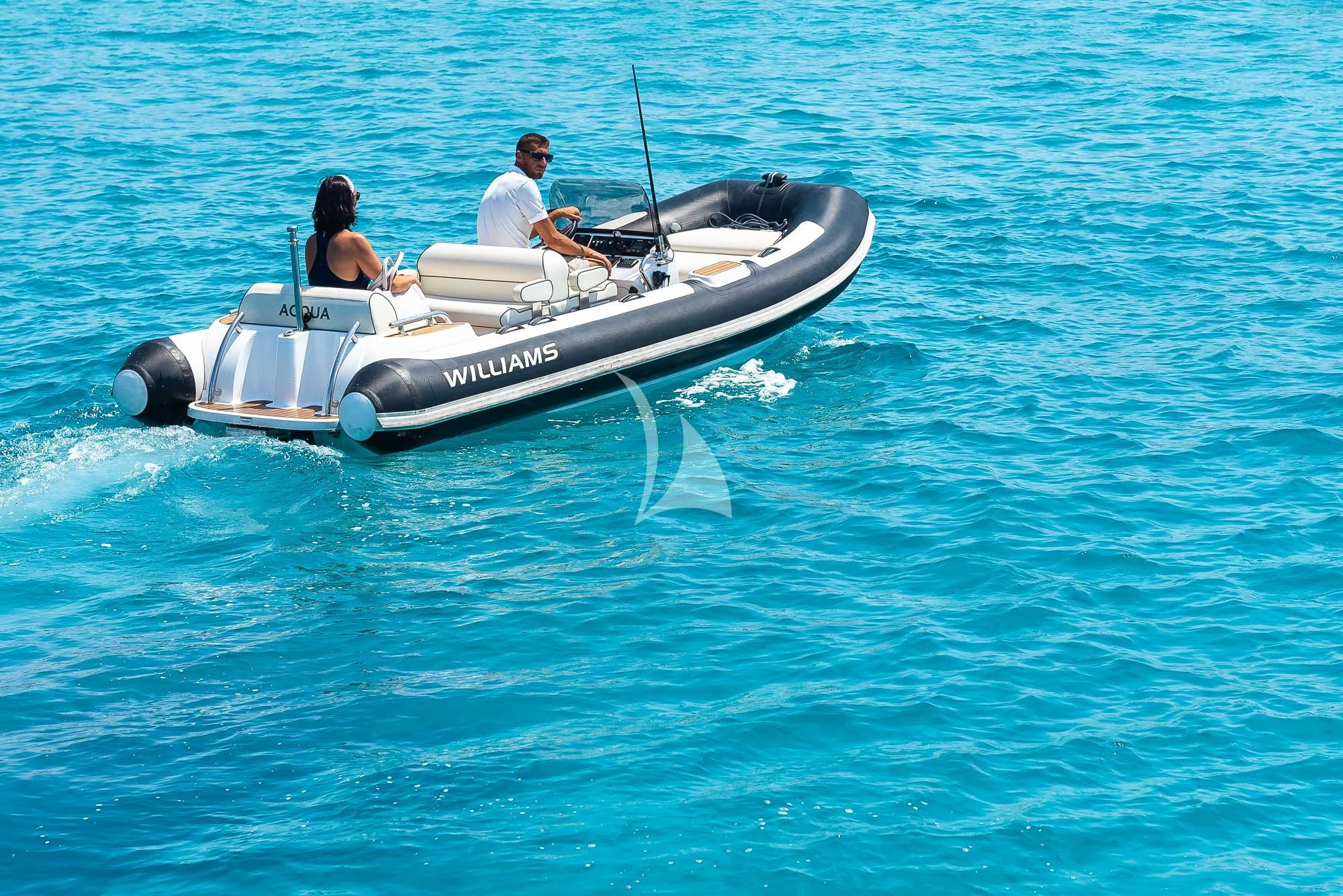 a man and woman in a small boat aboard ACQUA Yacht for Sale
