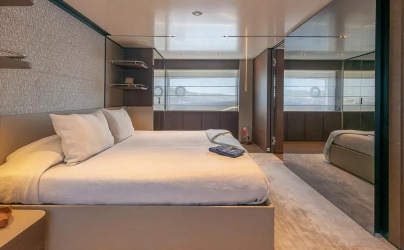 a bed in a room aboard ACQUA Yacht for Sale