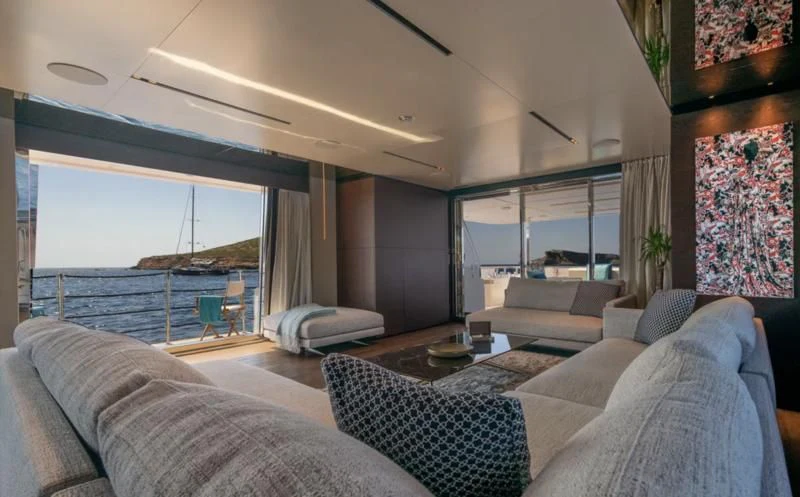 a living room with a large window aboard ACQUA Yacht for Sale