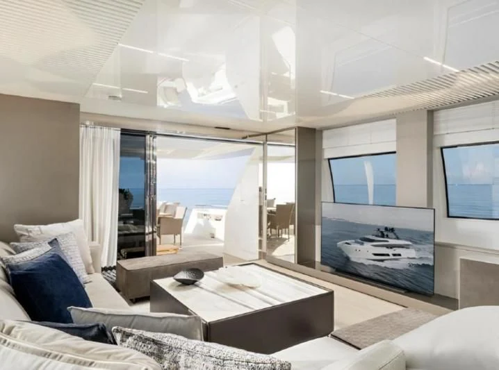 a room with a large window and a couch aboard YEMAJA Yacht for Sale