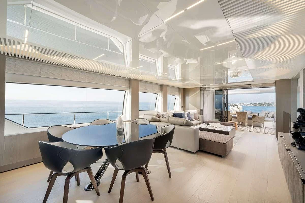 a room with a table and chairs aboard YEMAJA Yacht for Sale