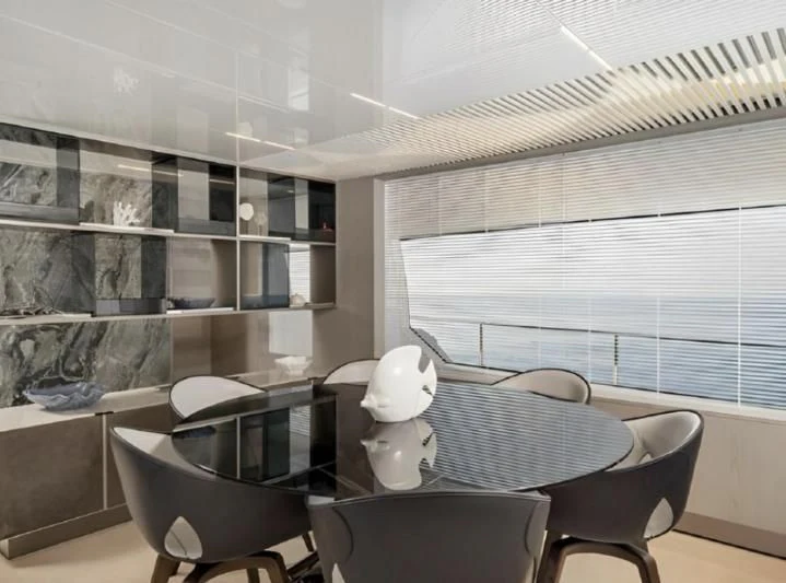 a room with a table and chairs aboard YEMAJA Yacht for Sale