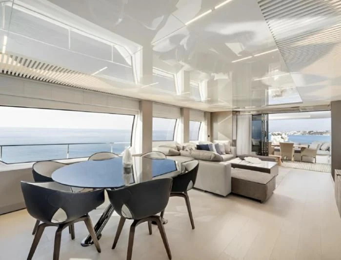a room with a table and chairs aboard YEMAJA Yacht for Sale