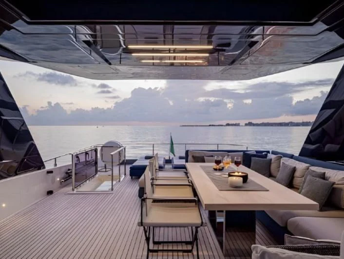 a room with a table and chairs aboard YEMAJA Yacht for Sale