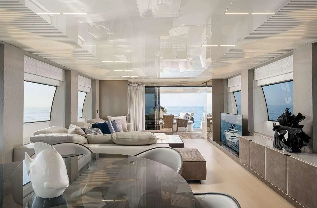 a living room with a large window aboard YEMAJA Yacht for Sale