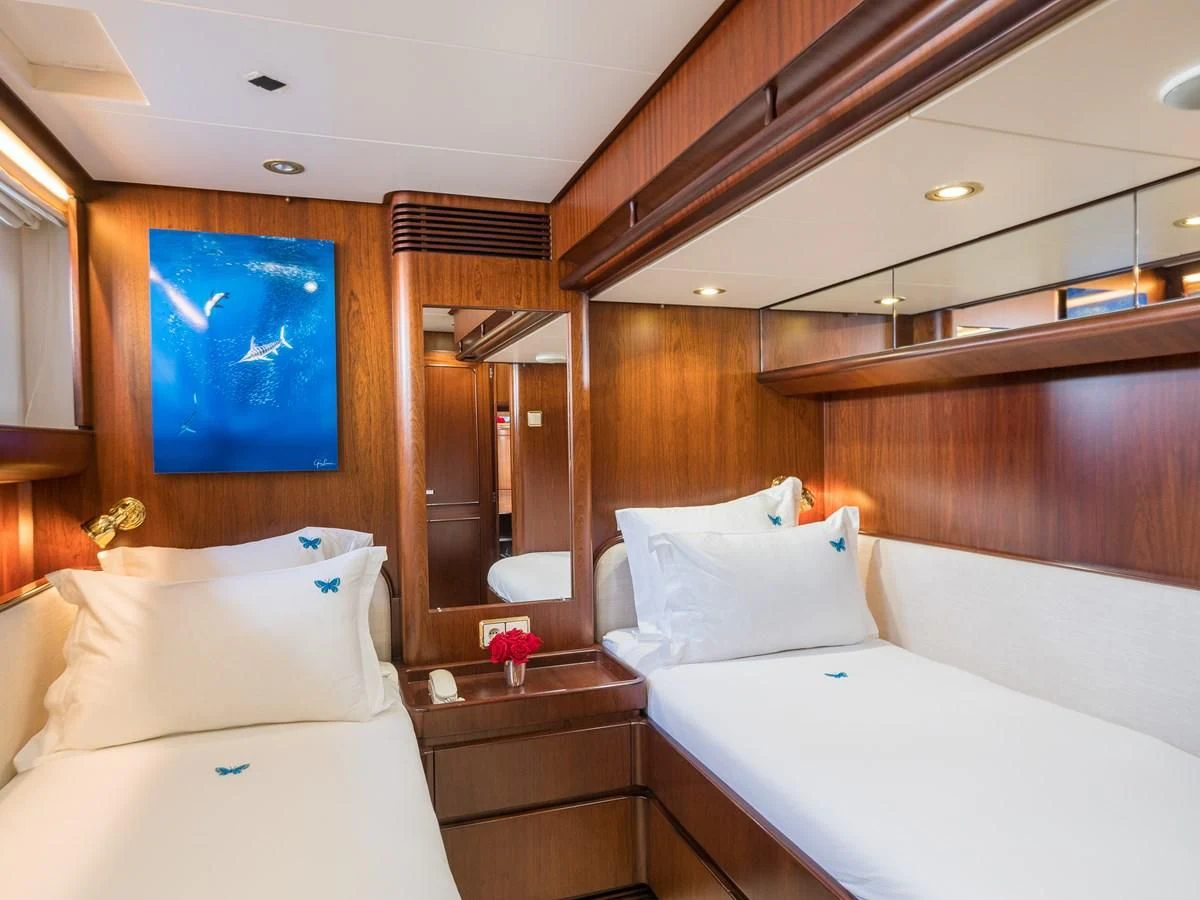 a room with two beds aboard BLUE PAPILLON Yacht for Sale