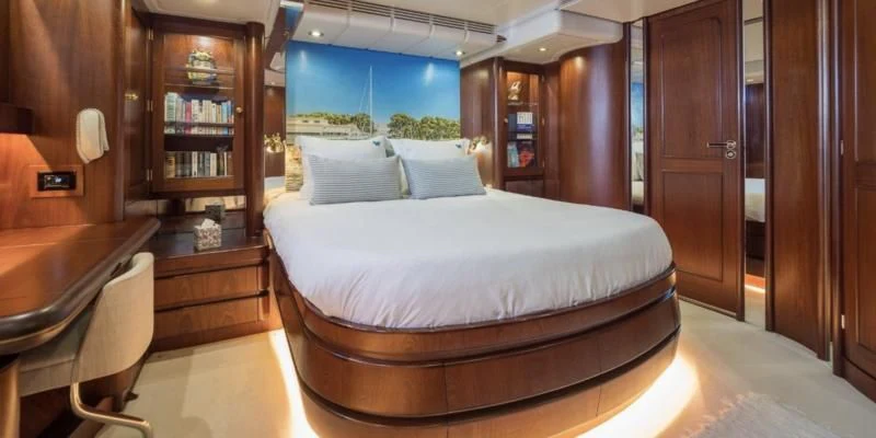 a bed in a room aboard BLUE PAPILLON Yacht for Sale