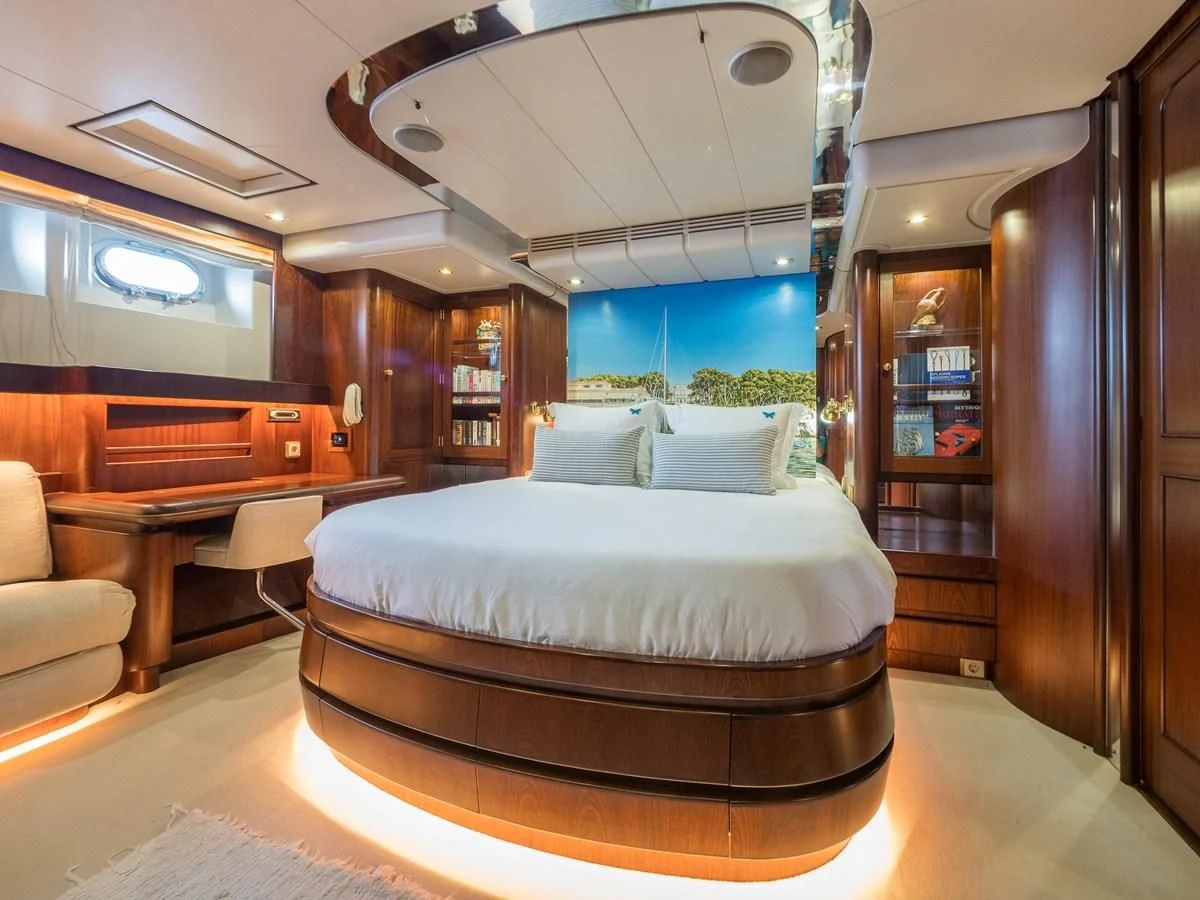 a large bed in a room aboard BLUE PAPILLON Yacht for Sale