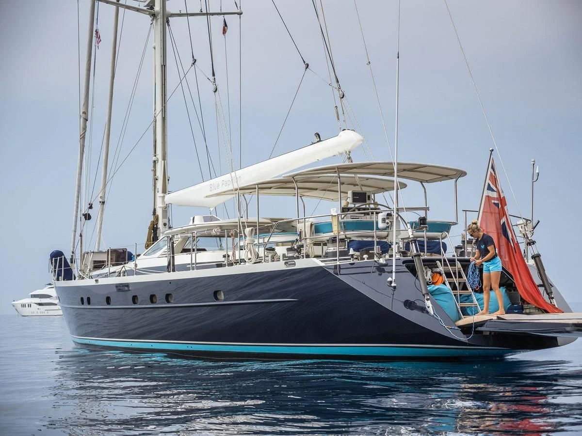 a boat with a person on it aboard BLUE PAPILLON Yacht for Sale