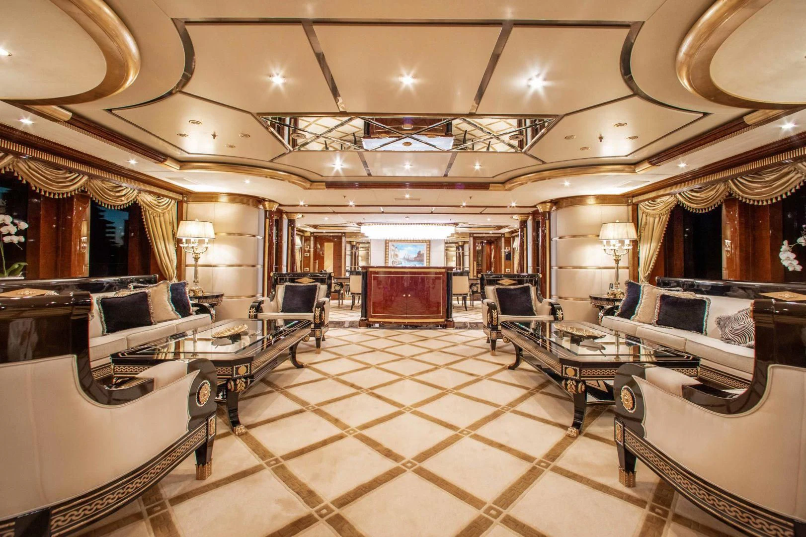 a large room with a large table and chairs aboard SORRENTO Yacht for Sale