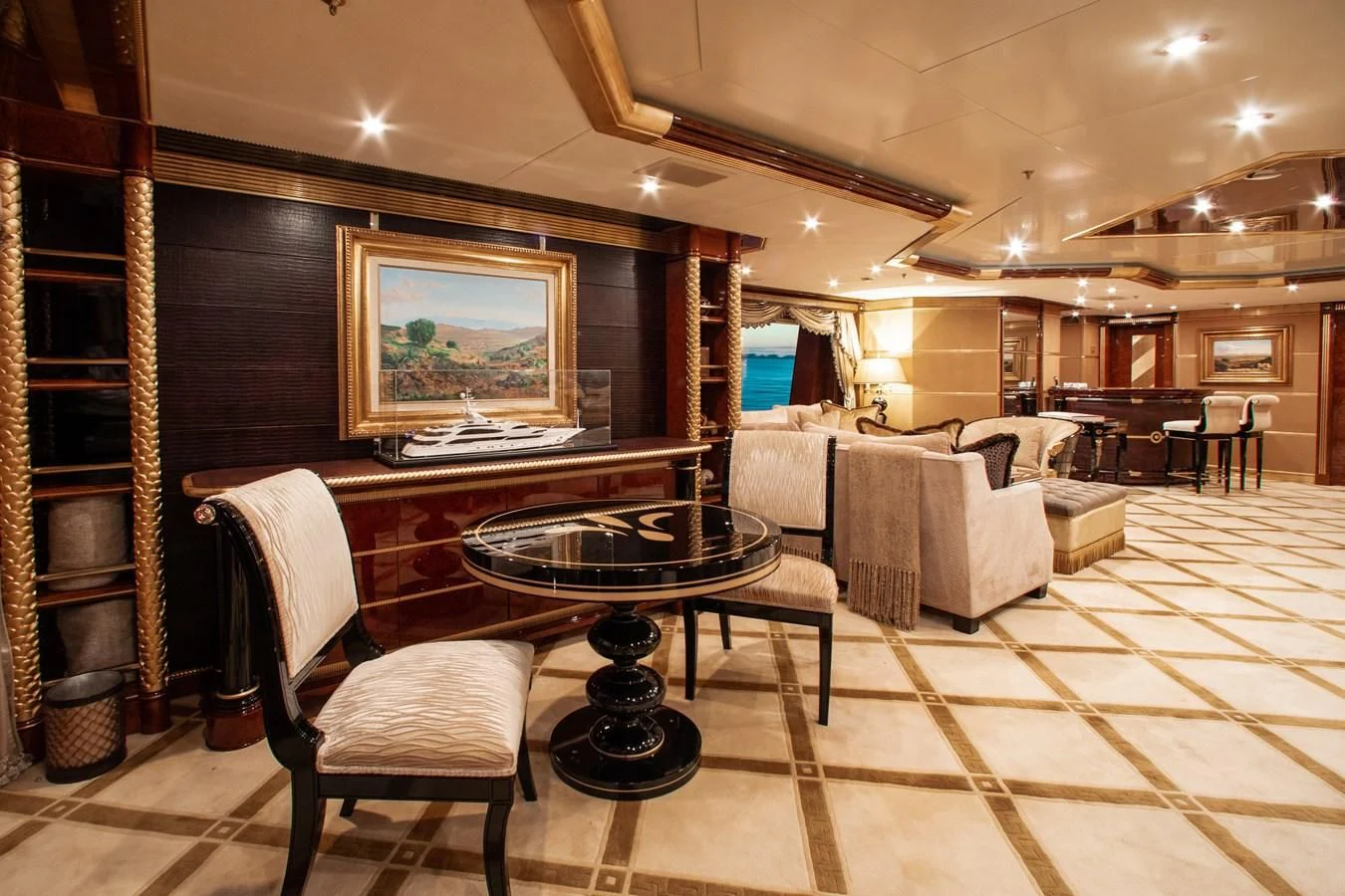 a large room with a piano and a table aboard SORRENTO Yacht for Sale