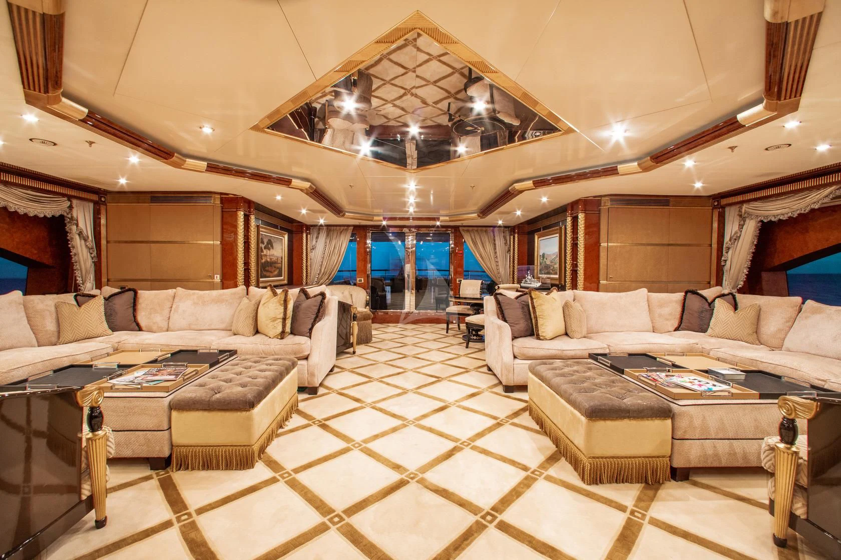 a large living room with a large open roof aboard SORRENTO Yacht for Sale
