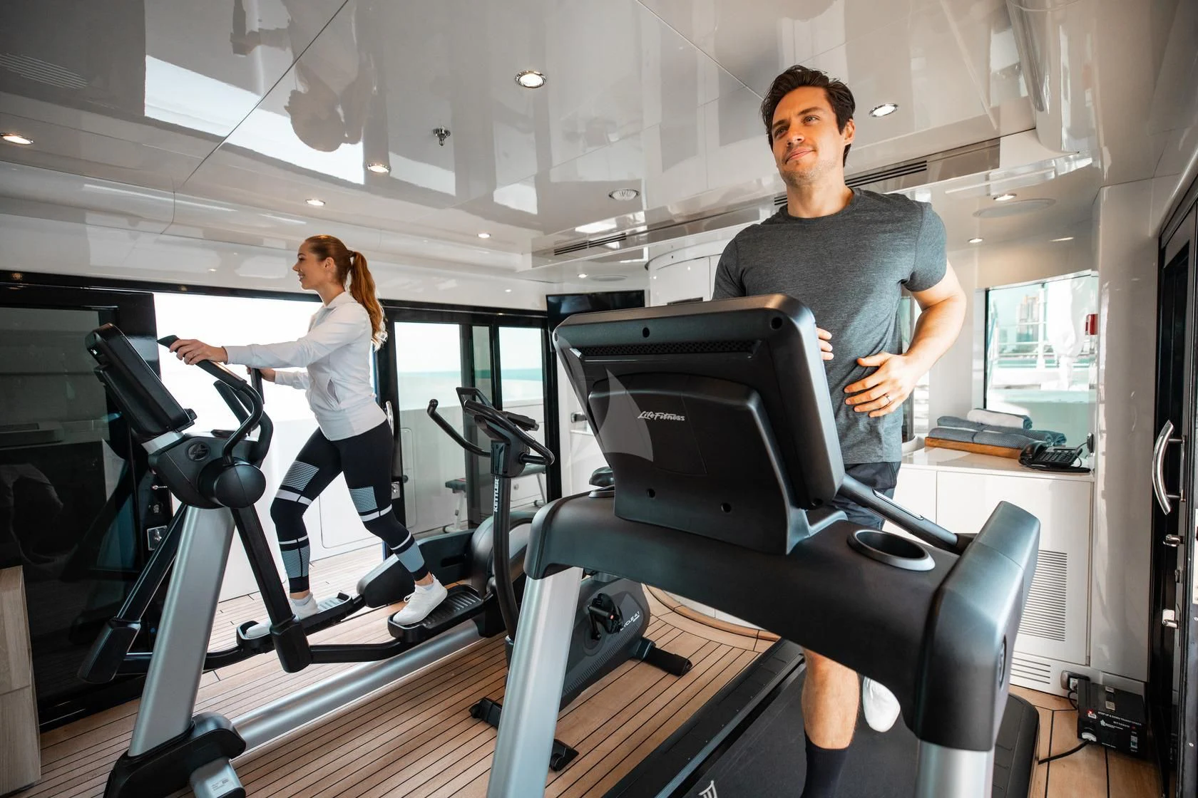 a man and a woman working out in a gym aboard SORRENTO Yacht for Sale