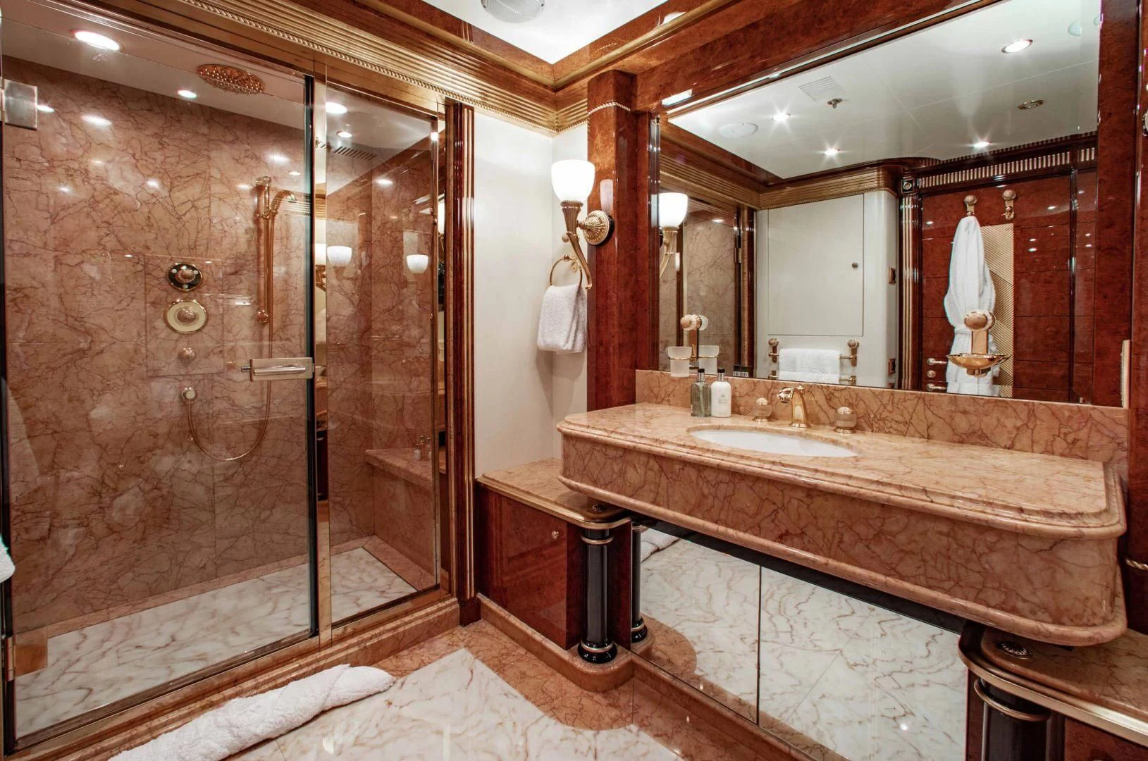 a bathroom with a large marble countertop aboard SORRENTO Yacht for Sale