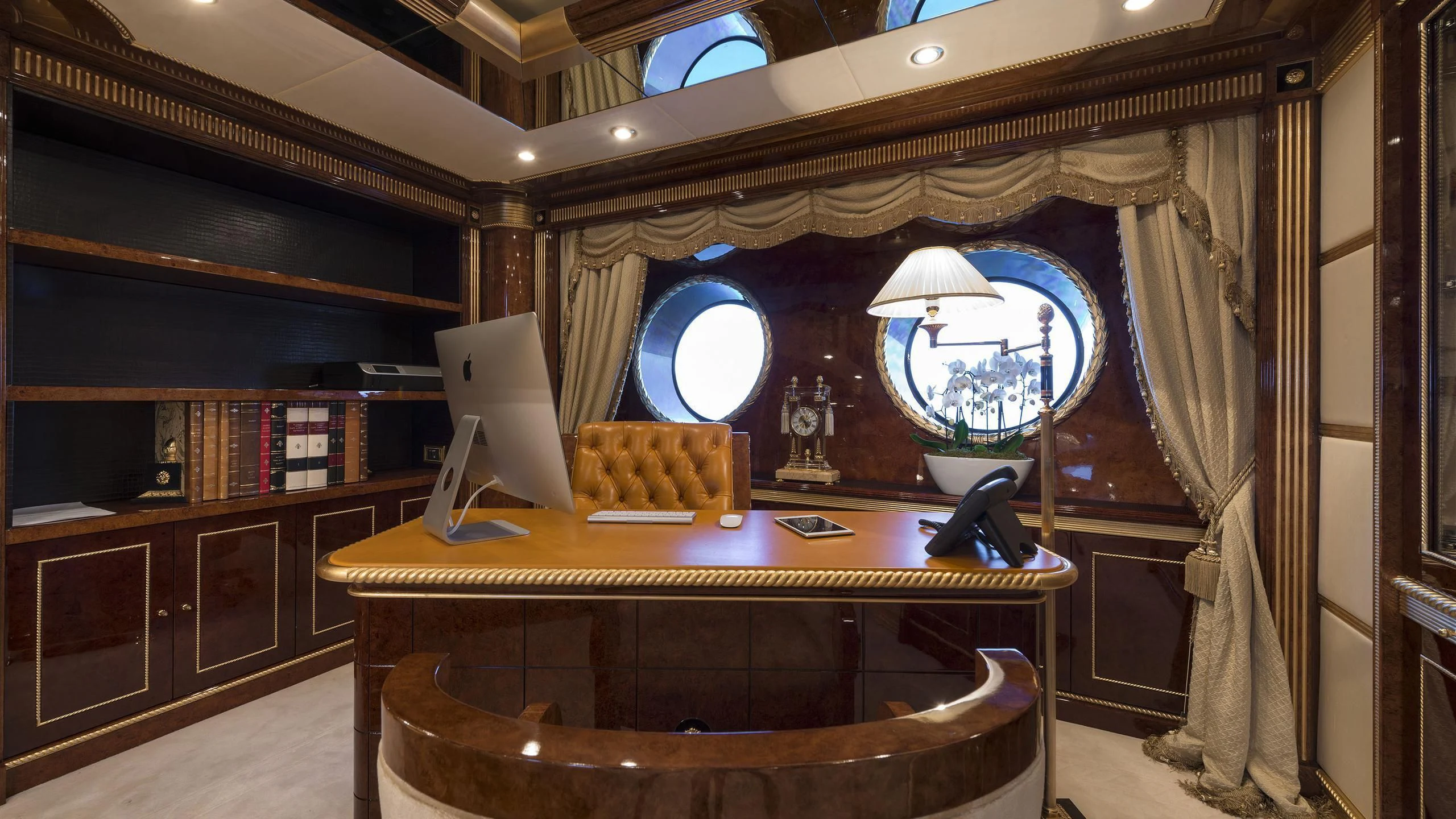 a room with a desk and a window aboard SORRENTO Yacht for Sale
