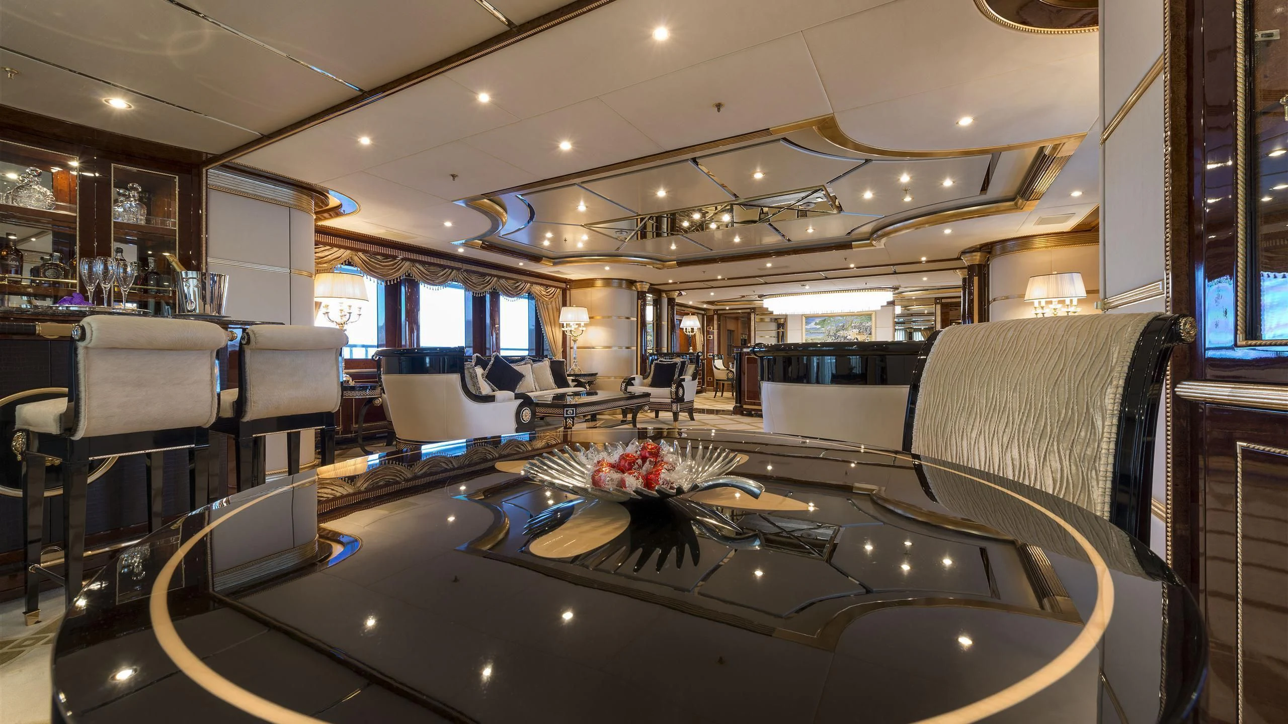 a room with a table and chairs aboard SORRENTO Yacht for Sale