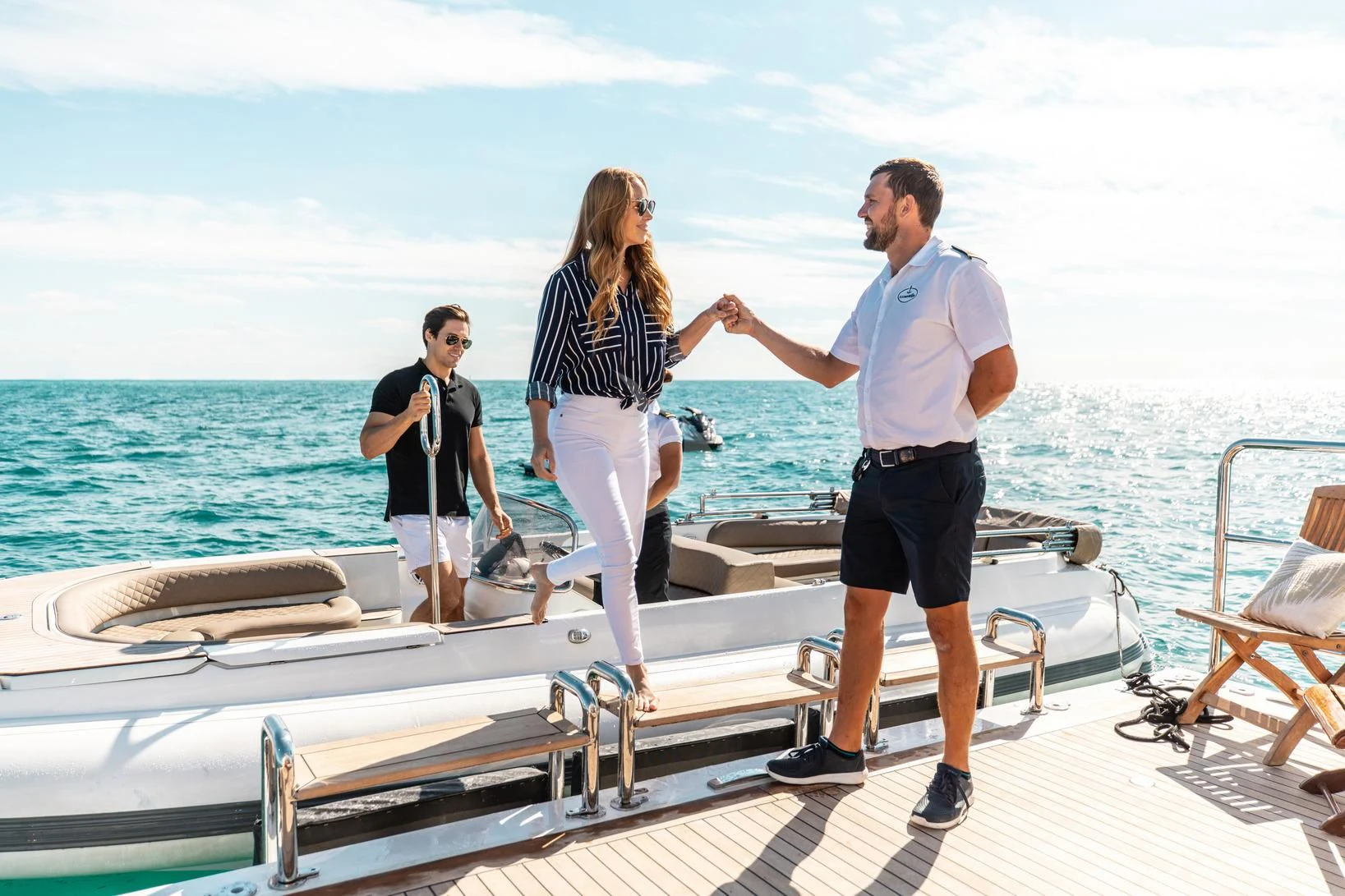 a group of people standing on a boat aboard SORRENTO Yacht for Sale