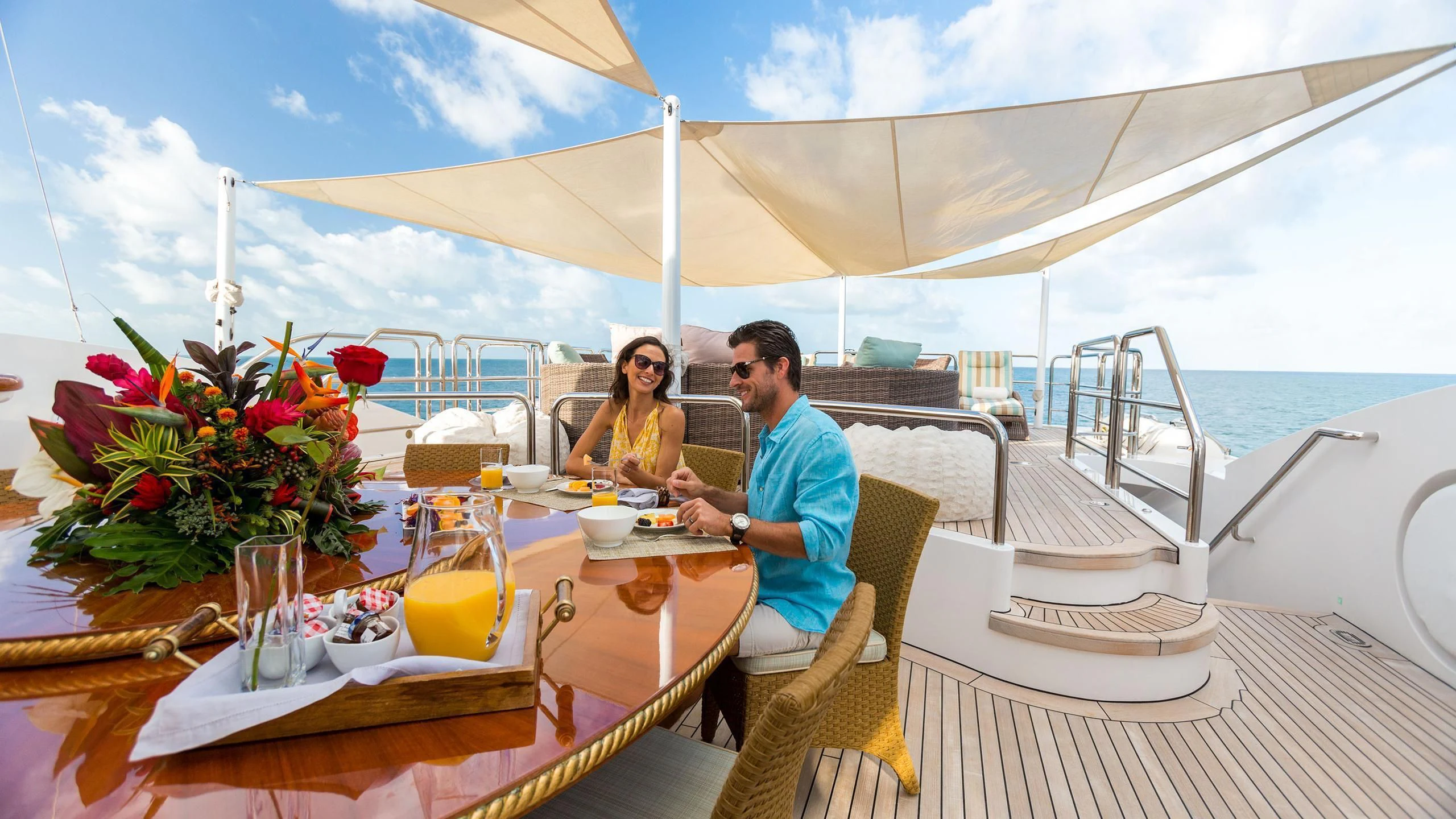 a couple sitting at a table aboard SORRENTO Yacht for Sale