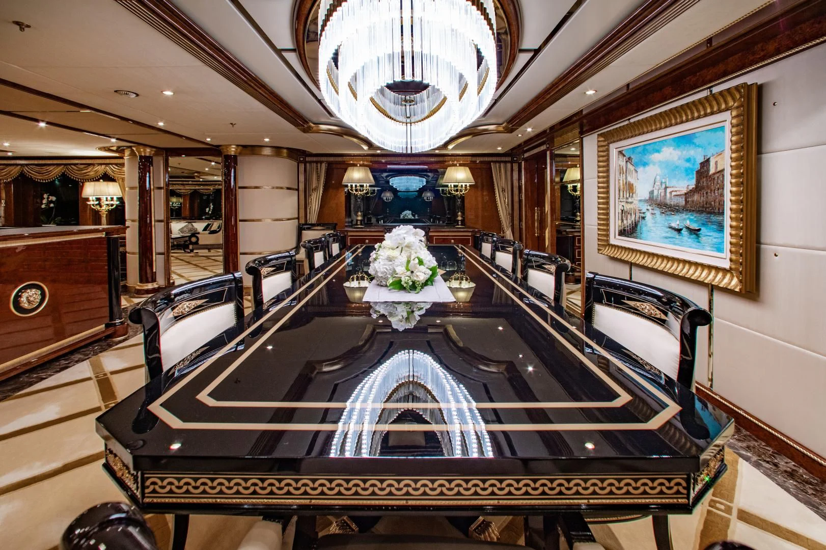 a large room with a piano and flowers on the floor aboard SORRENTO Yacht for Sale