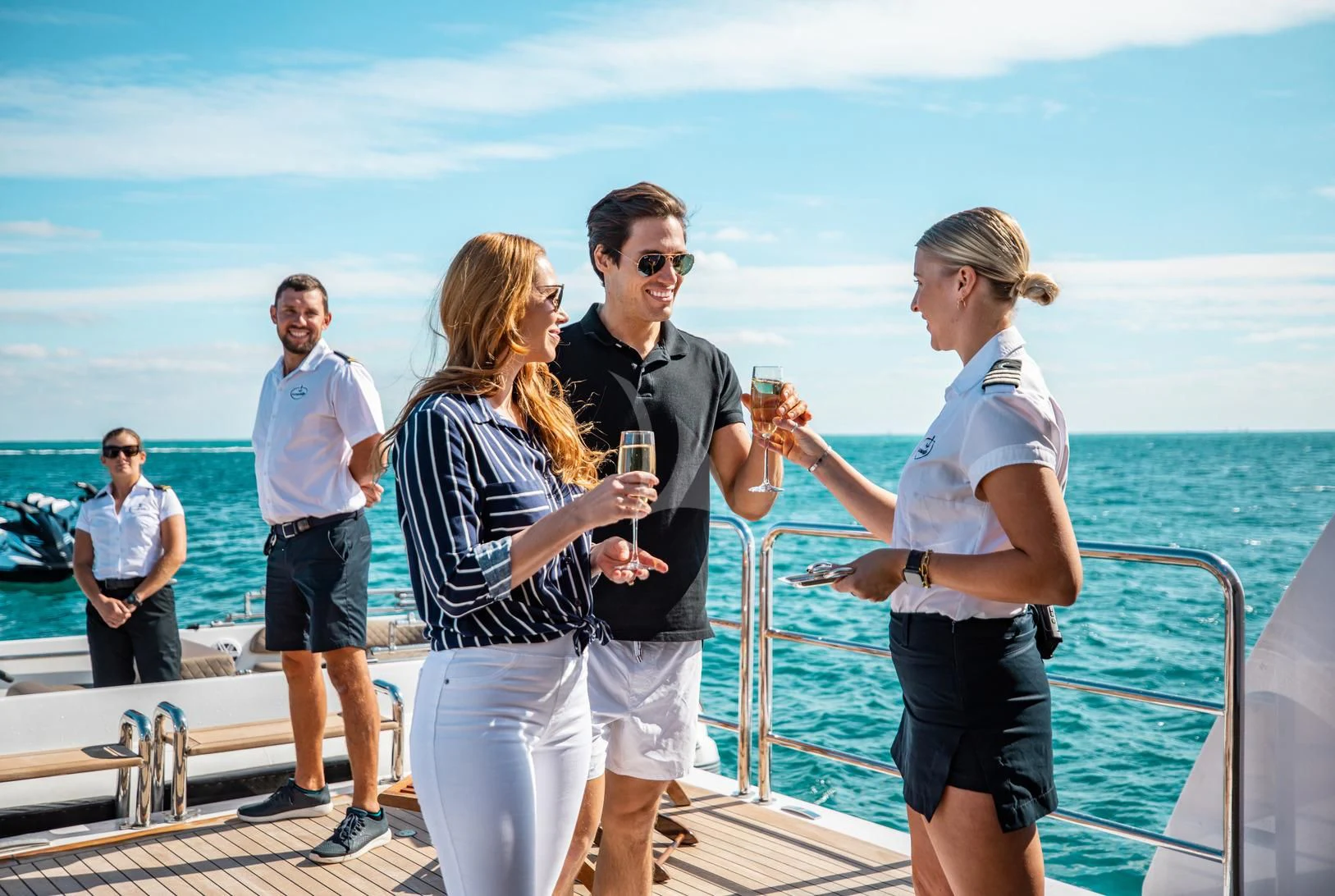 a group of people standing on a boat holding wine glasses aboard SORRENTO Yacht for Sale