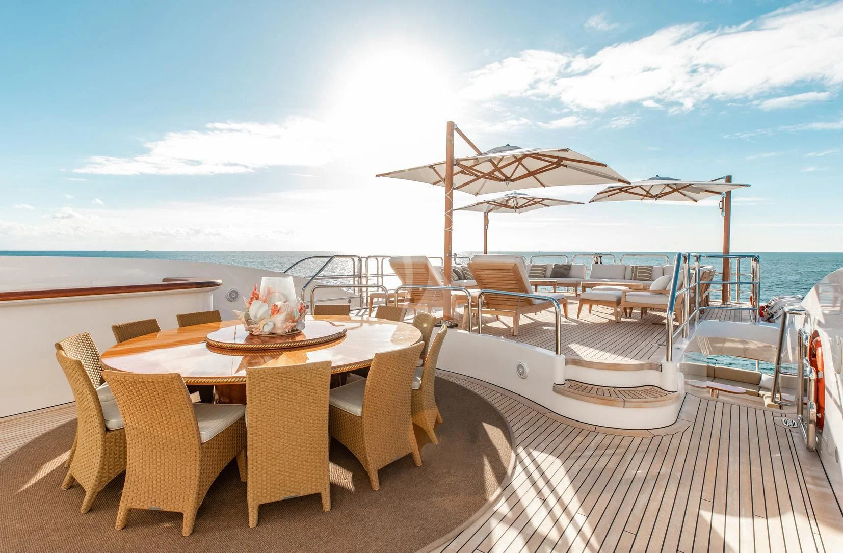 a table and chairs on a deck aboard SORRENTO Yacht for Sale