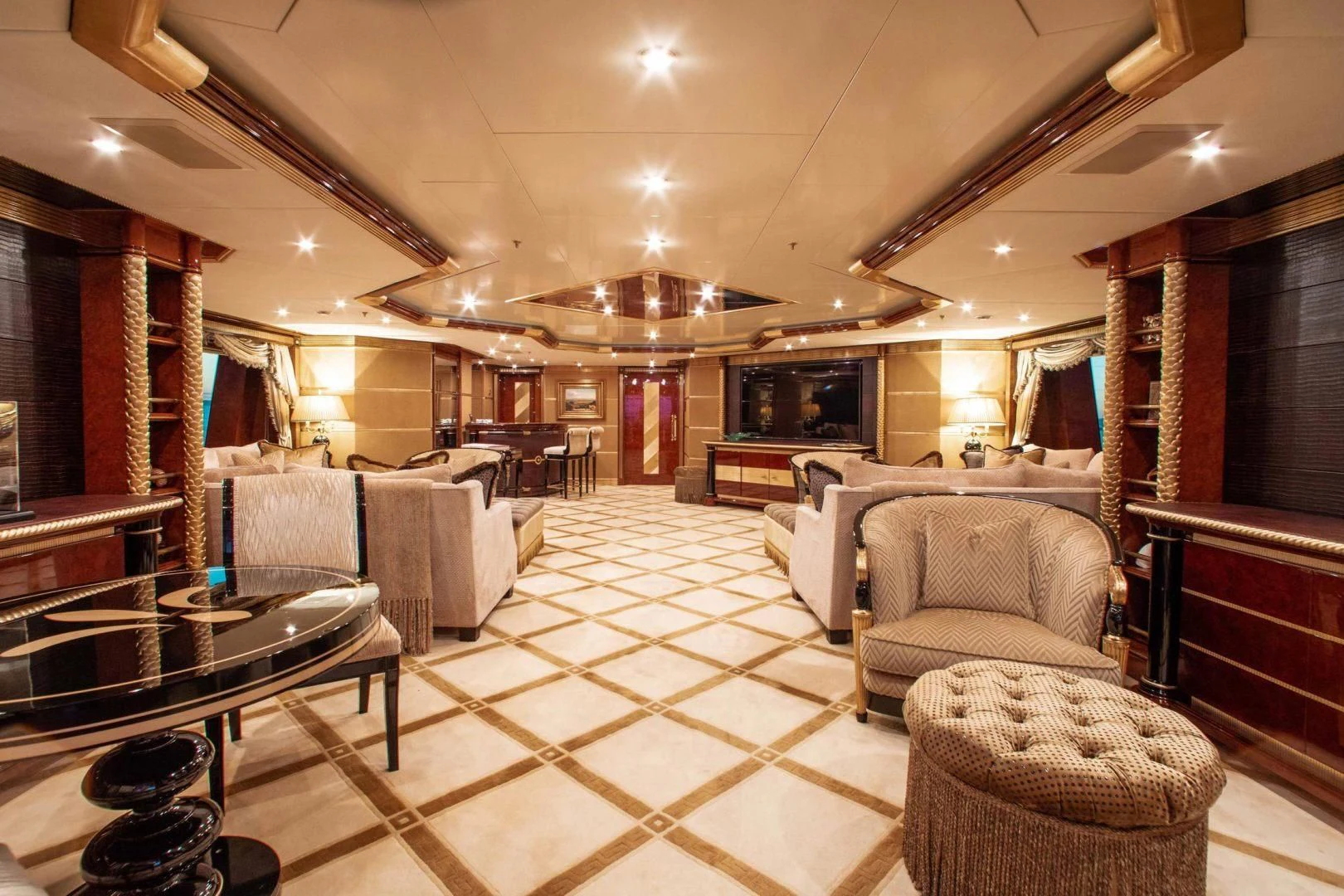 a large living room with a large mirror aboard SORRENTO Yacht for Sale
