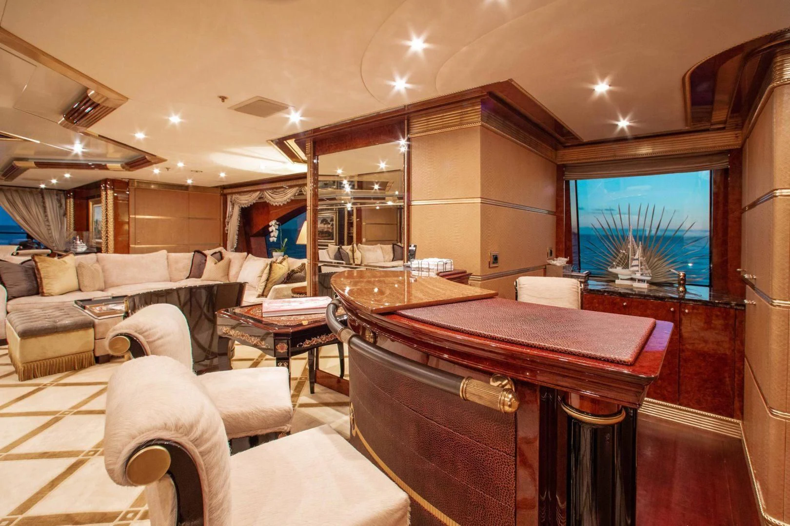 a living room with a bar and a television aboard SORRENTO Yacht for Sale