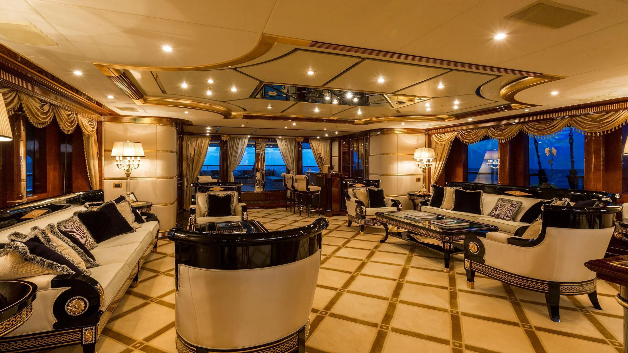 a large room with a couch and a table and chairs aboard SORRENTO Yacht for Sale