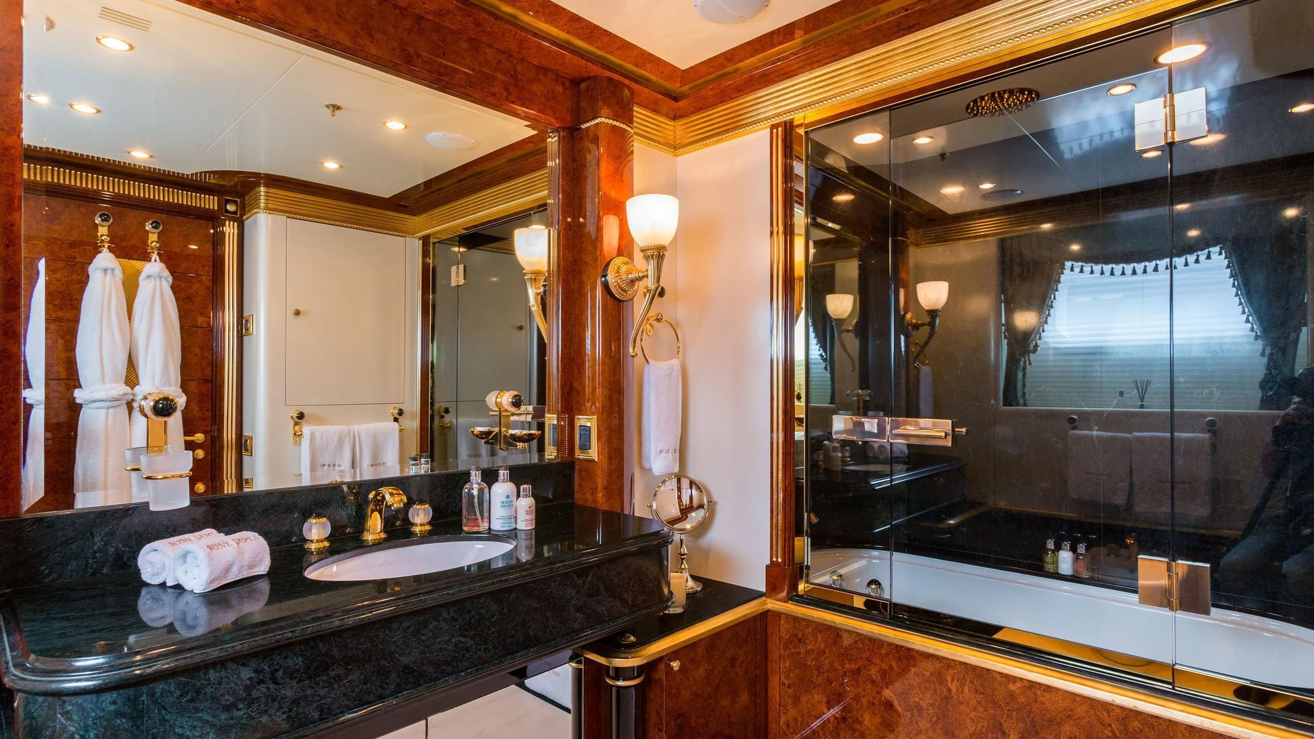 a bathroom with a large mirror aboard SORRENTO Yacht for Sale