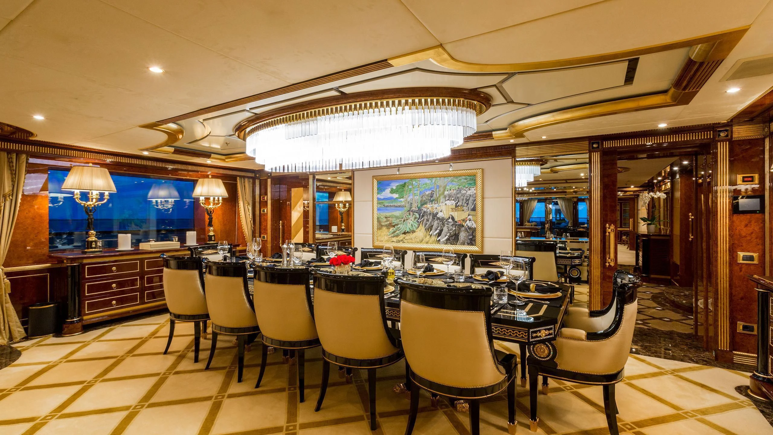 a large room with tables and chairs aboard SORRENTO Yacht for Sale